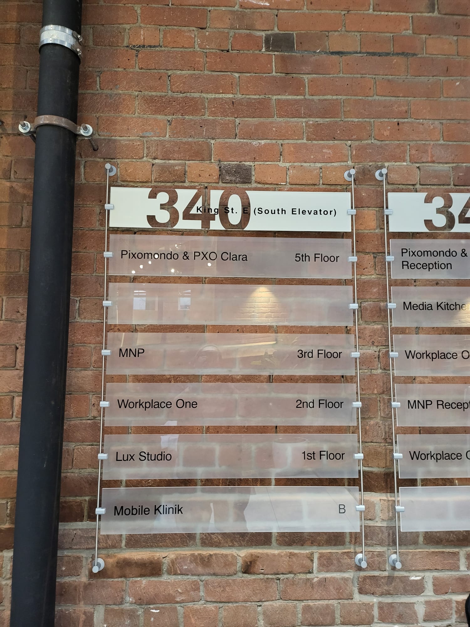 Acrylic directory at 340 King St E