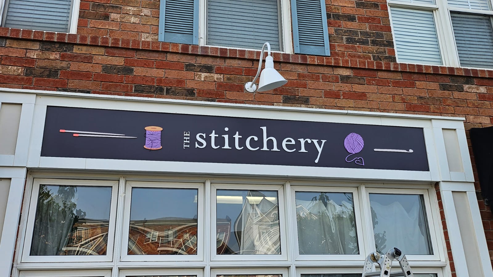 The Stitchery fascia sign on a storefront